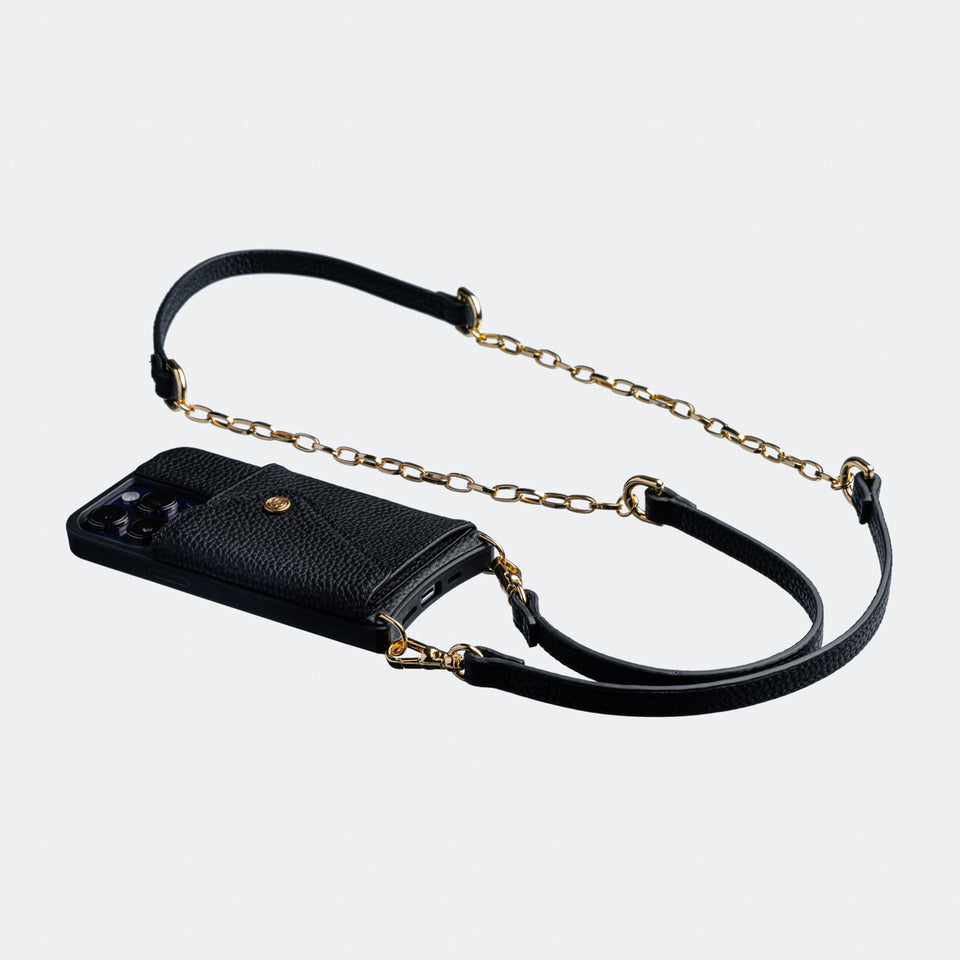 Black Bandolier-style Side angle view of a black leather crossbody phone case, highlighting the adjustable leather strap and slim profile
