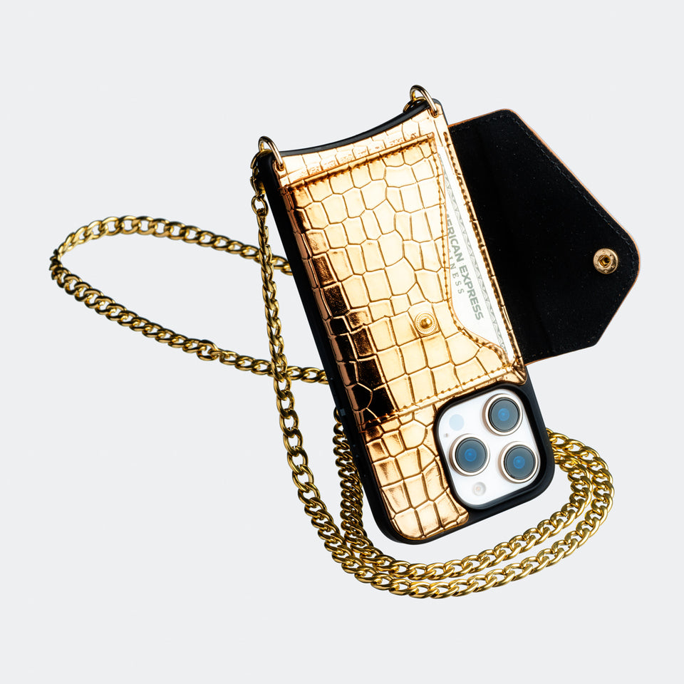 gold vegan Bandolier-style crossbody phone case featuring a built-in wallet and secure card slots for convenience and style.