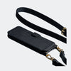 Black Bandolier-style leather crossbody phone case featuring a built-in wallet and secure card slots.