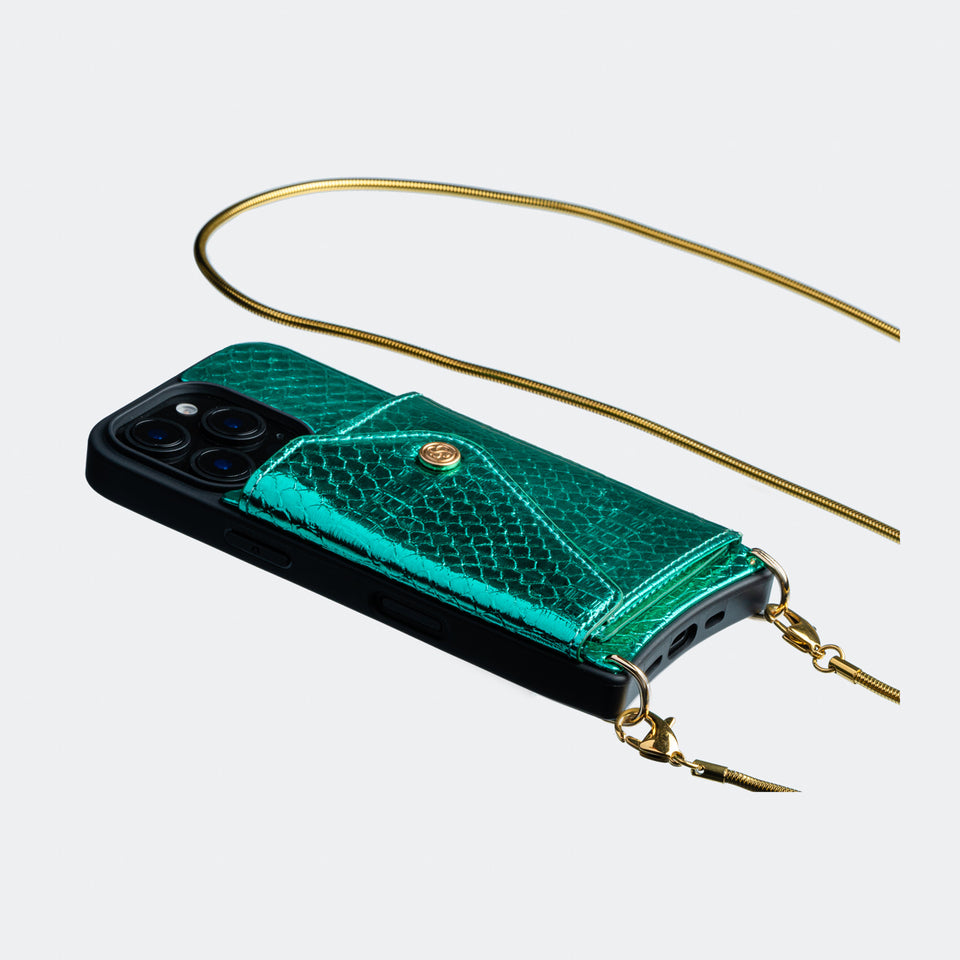 Side angle of the green vegan leather crossbody phone case, showcasing its adjustable strap and slim, minimalist profile.